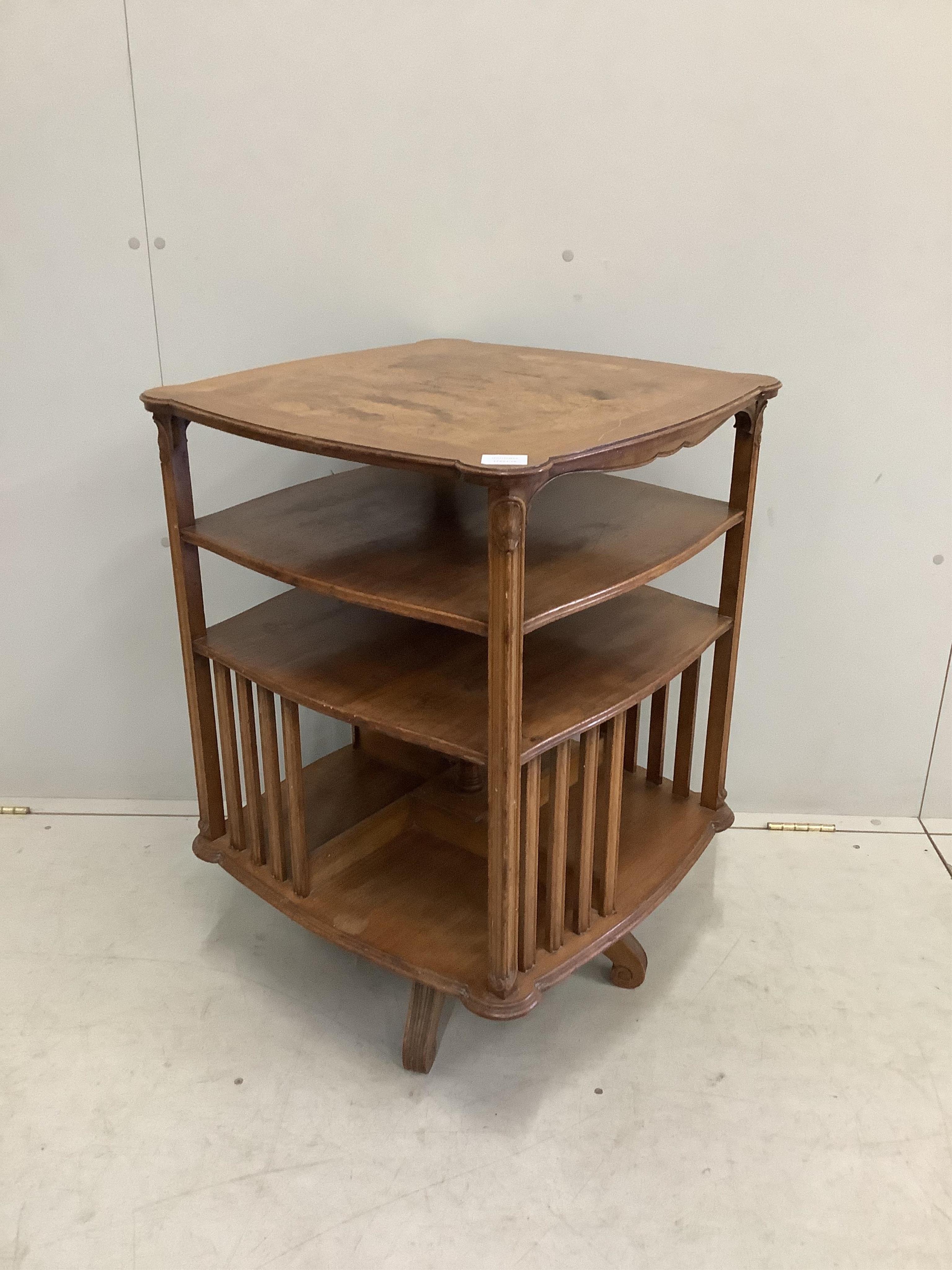 An early 20th century walnut revolving bookcase, width 57cm, height 80cm